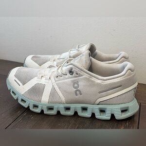 On Cloud White and Light Blue Athletic Shoes